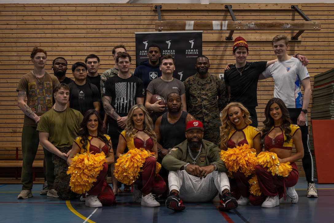 Members of the Washington Commanders’ Command Force, retired football players, U.S. Marines, and Norwegian troops pose for a group photo after a combined workout session in Setermoen, Norway, Feb. 28, 2026. The visit was part of an Armed Forces Entertainment tour that brought NFL personalities, mixed martial arts fighters, and musicians to service members deployed for exercise Cold Response 26. (U.S. Marine Corps photo by Sgt. Alexis French)