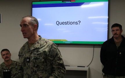 Cmdr. Avondoglio, commanding officer of Navy Reserve Cyber Protection Team Pensacola, speaks to participating cyber protection teams during Mobilization Exercise (MOBEX) January 2026.  MOBEX’s translate classroom instruction into operational readiness in support of reserve integration for future operations.  (U.S. Navy photo by Intelligence Specialist 3rd Class Hennessy)
