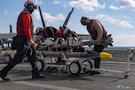 U.S. Sailors handle ordnance on the flight deck of the world’s largest aircraft carrier, USS Gerald R. Ford (CVN 78), while operating in support of Operation Epic Fury in the Eastern Mediterranean Sea, March 2, 2026. (U.S. Navy photo)