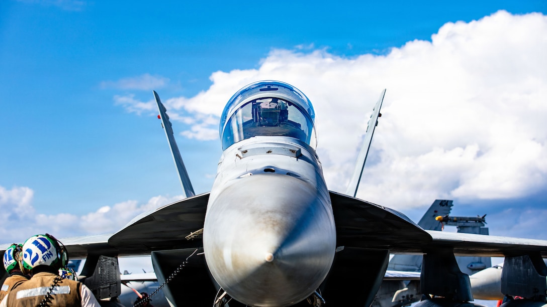 U.S. Sailors conduct post-flight checks on an F/A-18F Super Hornet aircraft, attached to Strike Fighter Squadron 213, on the flight deck of the world's largest aircraft carrier, USS Gerald R. Ford (CVN 78), while operating in support of Operation Epic Fury in the Eastern Mediterranean Sea, March 2, 2026. (U.S. Navy photo)