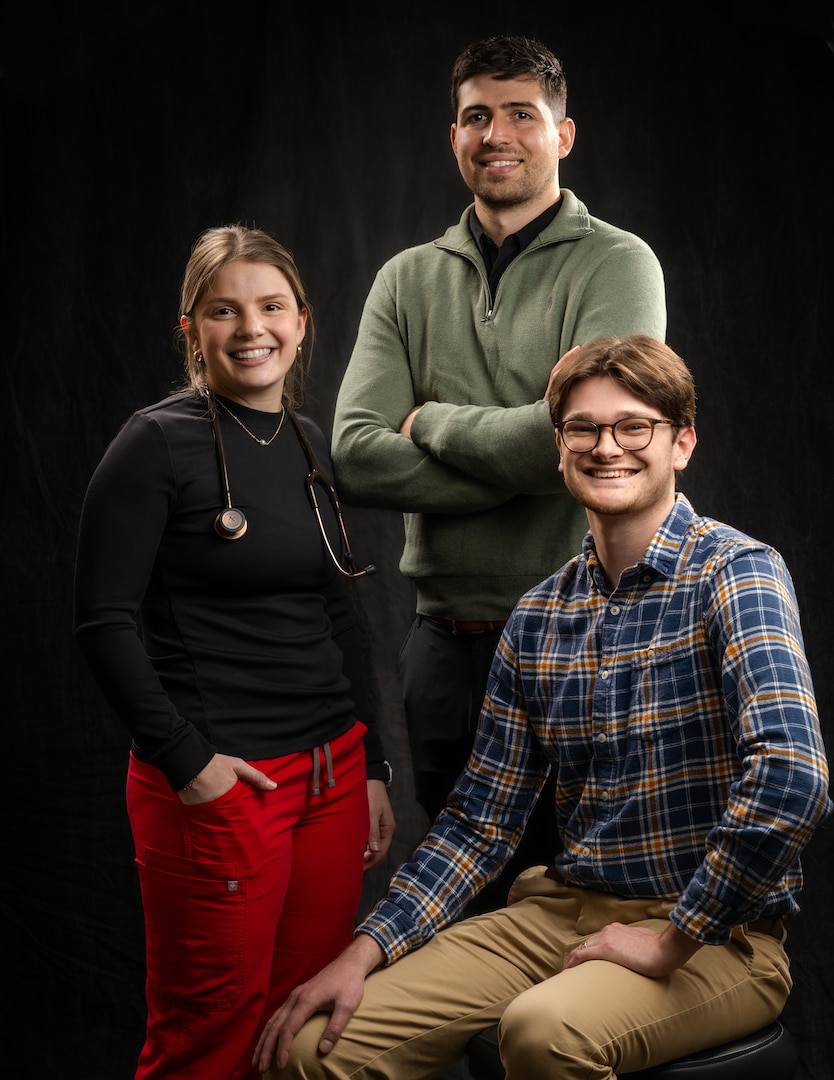 The next generation of medical providers gets a firsthand look at military healthcare at Irwin Army Community Hospital. Second-year Kansas State University physician assistant students (from left) Maggie Nation, John Lunn, and Matthew Ruether (sitting) started clinical rotations at Fort Riley, Kansas, Feb. 23, 2026, where they are learning how to apply "readiness-focused medicine" to support the warfighter.