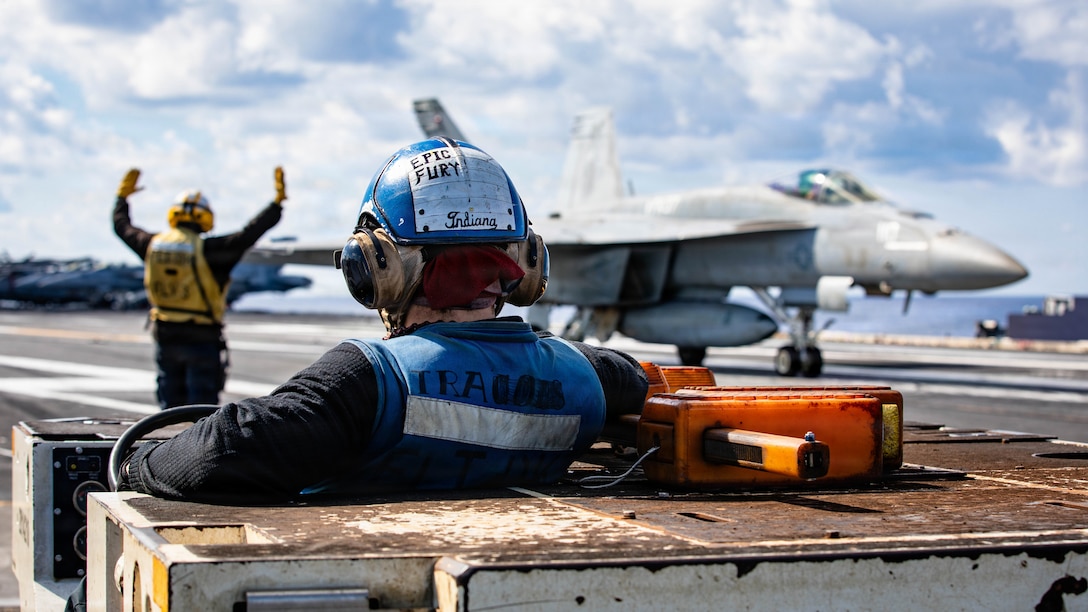 A U.S. Sailor observes an F/A-18E Super Hornet aircraft, attached to Strike Fighter Squadron 37, land on the flight deck of the world's largest aircraft carrier, USS Gerald R. Ford (CVN 78), while operating in support of Operation Epic Fury in the Eastern Mediterranean Sea, March 2, 2026. (U.S. Navy photo)