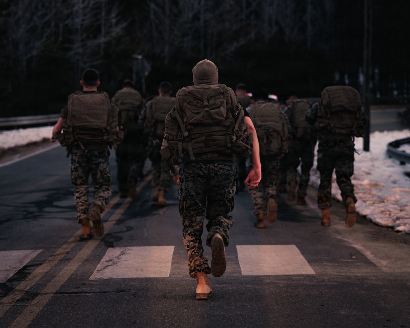 U.S. Marines with Martial Arts Instructor course 42-26 conduct a group run during the culminating event at The Basic School on Marine Corps Base Quantico, Virginia, Feb. 13, 2026. The MAI culminating event combines techniques used within the Marine Corps Martial Arts program in one final test to ensure the Marines are ready to conduct belt advancement within individual units to uphold the tradition of warrior ethos in the corps. (U.S. Marine Corps photo by Cpl. Braydon Rogers)