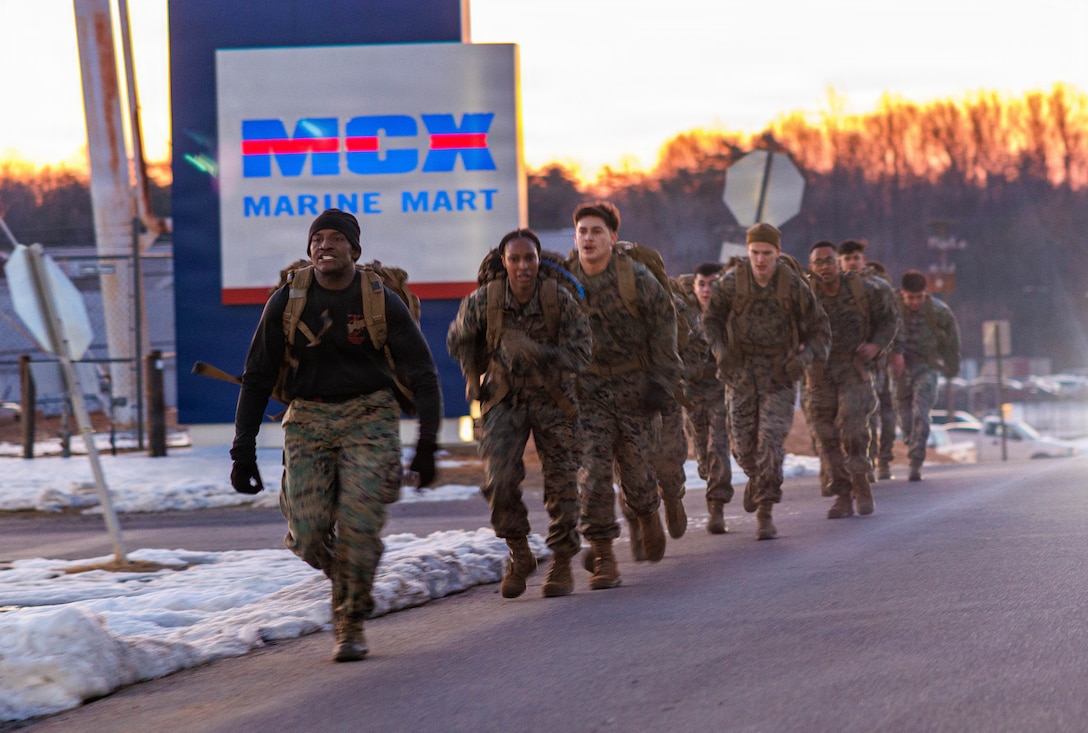U.S. Marines with Martial Arts Instructor course 42-26 conduct a group run during the culminating event at The Basic School on Marine Corps Base Quantico, Virgina, Feb. 13, 2026. The MAI culminating event combines techniques used within the Marine Corps Martial Arts Program in one final test to ensure the marines are ready to conduct belt advancement within individual units to uphold the tradition of warrior ethos in the corps. (U.S. Marine Corps photo by Lance Cpl. Donovan E. Melendez)