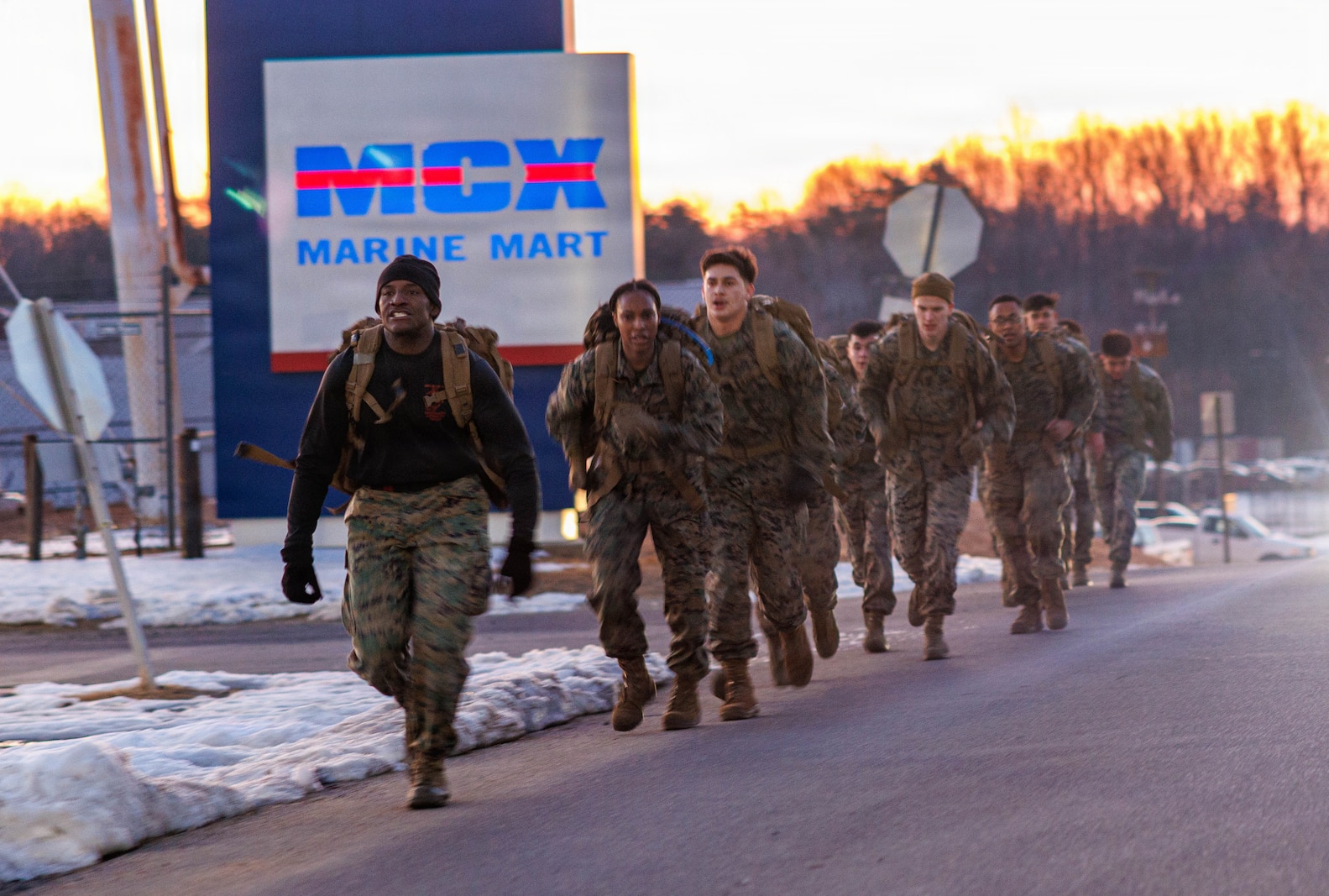 U.S. Marines with Martial Arts Instructor course 42-26 conduct a group run during the culminating event at The Basic School on Marine Corps Base Quantico, Virgina, Feb. 13, 2026. The MAI culminating event combines techniques used within the Marine Corps Martial Arts Program in one final test to ensure the marines are ready to conduct belt advancement within individual units to uphold the tradition of warrior ethos in the corps. (U.S. Marine Corps photo by Lance Cpl. Donovan E. Melendez)