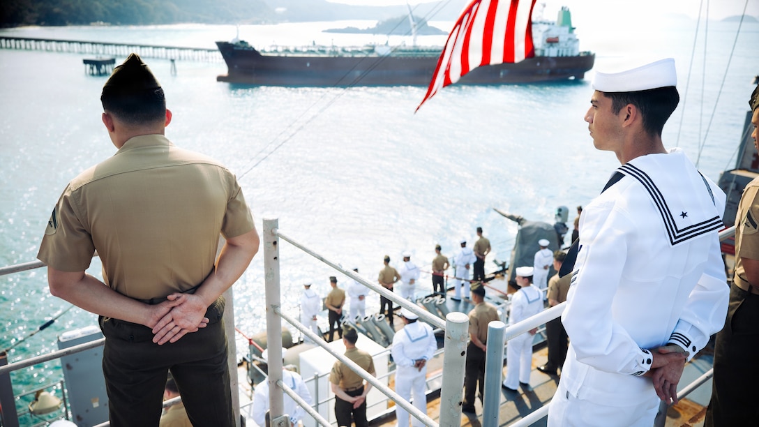 U.S. Marines and Sailors assigned to Task Force Ashland, I Marine Expeditionary Force, man the rails aboard amphibious dock landing ship USS Ashland (LSD 48) during a sea and anchor detail upon arrival for Exercise Cobra Gold 2026 in the Gulf of Thailand, Feb. 22, 2026.