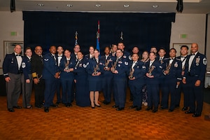a group of people stand on a stage