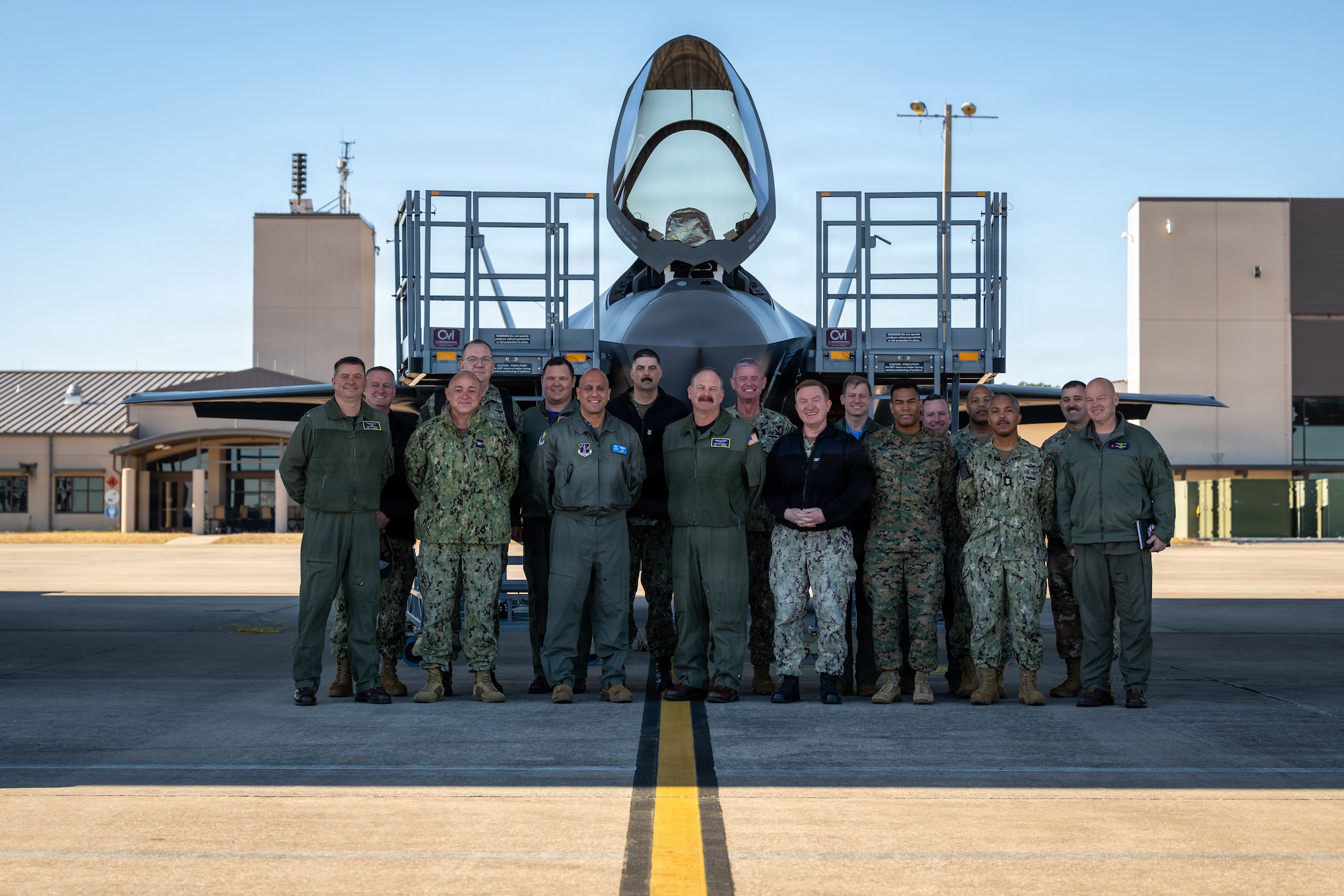 125th Fighter Wing leadership poses with local Jacksonville military leaders in a group photo in front of a F-35A aircraft.