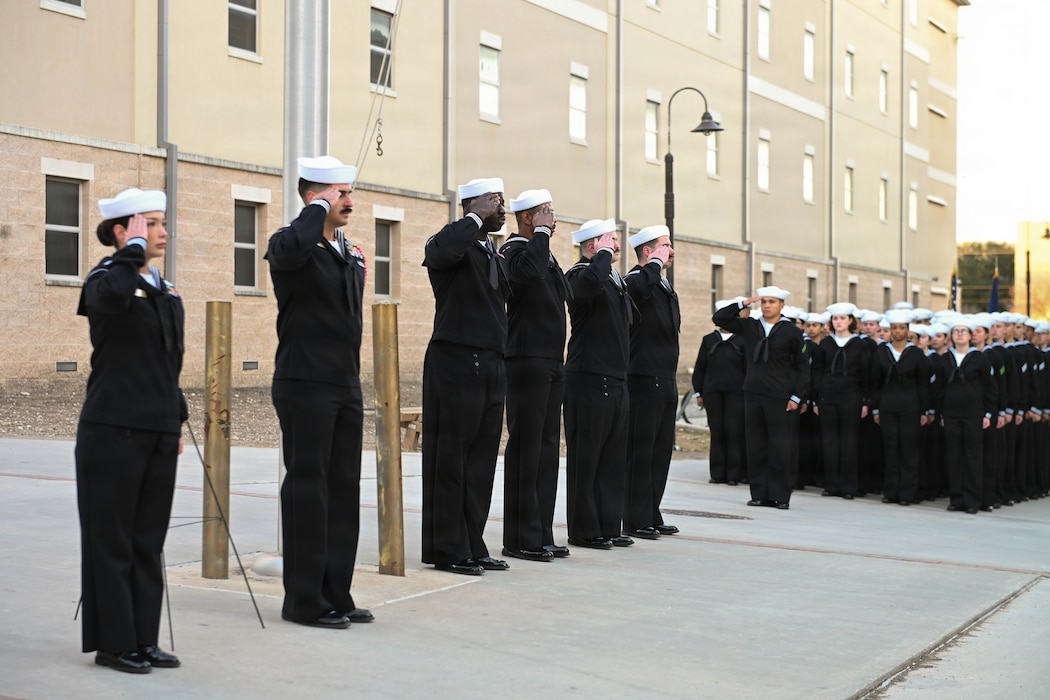 Navy Medicine Training Support Command Sailors render a salute during the playing of ‘Taps’ at the Hospital Corpsman Third Class John T. Fralish Memorial held at Joint Base San Antonio-Fort Sam Houston, Texas, Feb. 6, 2026. This year marks the 20th anniversary of Fralish’s passing during the War on Terror. (U.S. Navy photo by Mass Communication Specialist Seaman Apprentice Christine Walters).