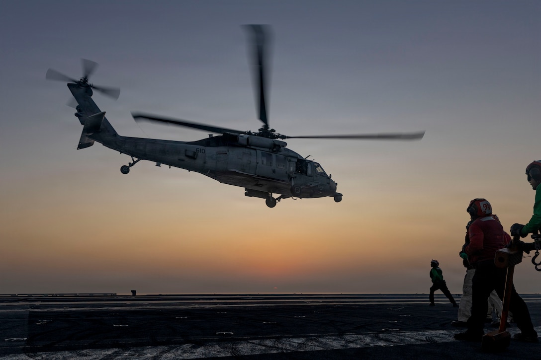 An MH-60S Sea Hawk helicopter, attached to Helicopter Sea Combat Squadron (HSC) 14, takes off on the flight deck of Nimitz-class aircraft carrier USS Abraham Lincoln (CVN 72) in support of Operation Epic Fury, March. 2, 2026. (U.S. Navy photo)