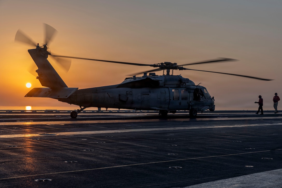 An MH-60S Sea Hawk helicopter, attached to Helicopter Sea Combat Squadron (HSC) 14, lands on the flight deck of Nimitz-class aircraft carrier USS Abraham Lincoln (CVN 72) in support of Operation Epic Fury, March. 2, 2026. (U.S. Navy photo)