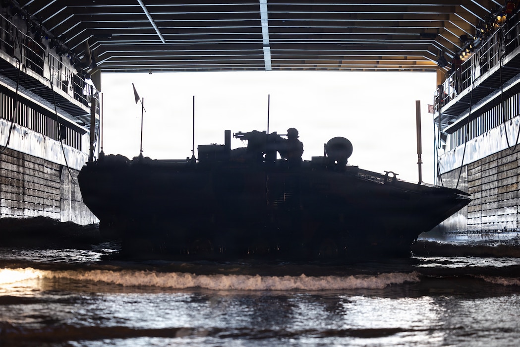 A U.S. Marine Corps amphibious combat vehicle, with Battalion Landing Team 3/5, 11th Marine Expeditionary Unit, docks on Whidbey Island-class dock landing ship USS Comstock (LSD 45) in the Pacific Ocean, Feb. 25, 2026. The 11th MEU is currently underway aboard the Boxer Amphibious Ready Group in the U.S. 3rd Fleet area of operations conducting integrated training that enhances lethality and warfighting readiness. (U.S. Marine Corps photo by Sgt. Trent A. Henry)