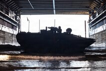 A U.S. Marine Corps amphibious combat vehicle, with Battalion Landing Team 3/5, 11th Marine Expeditionary Unit, docks on Whidbey Island-class dock landing ship USS Comstock (LSD 45) in the Pacific Ocean, Feb. 25, 2026. The 11th MEU is currently underway aboard the Boxer Amphibious Ready Group in the U.S. 3rd Fleet area of operations conducting integrated training that enhances lethality and warfighting readiness. (U.S. Marine Corps photo by Sgt. Trent A. Henry)