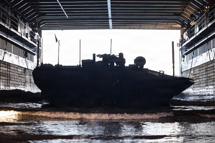 A U.S. Marine Corps amphibious combat vehicle, with Battalion Landing Team 3/5, 11th Marine Expeditionary Unit, docks on Whidbey Island-class dock landing ship USS Comstock (LSD 45) in the Pacific Ocean, Feb. 25, 2026. The 11th MEU is currently underway aboard the Boxer Amphibious Ready Group in the U.S. 3rd Fleet area of operations conducting integrated training that enhances lethality and warfighting readiness. (U.S. Marine Corps photo by Sgt. Trent A. Henry)