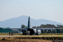 U.S. Airmen assigned to the 39th Airlift Squadron work alongside U.S. Soldiers from the Bravo Battery, 1st Battalion, 94th Field Artillery Regiment, 17th Field Artillery Brigade to load an M142 High Mobility Artillery Rocket System (HIMARS) onto a U.S. Air Force C-130J Super Hercules in support of a High Mobility Artillery Rocket System Rapid Infiltration (HIRAIN)  training during Exercise Cobra Gold 2026 at Lopburi, Thailand, March 1, 2026.
