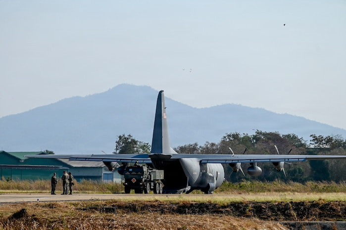 U.S. Airmen assigned to the 39th Airlift Squadron work alongside U.S. Soldiers from the Bravo Battery, 1st Battalion, 94th Field Artillery Regiment, 17th Field Artillery Brigade to load an M142 High Mobility Artillery Rocket System (HIMARS) onto a U.S. Air Force C-130J Super Hercules in support of a High Mobility Artillery Rocket System Rapid Infiltration (HIRAIN)  training during Exercise Cobra Gold 2026 at Lopburi, Thailand, March 1, 2026.