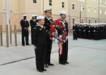 U.S. Navy Capt. Richard Lawrence, center, commanding officer of the Navy Medicine Training Support Command, along with Hospital Corpsman Second Class Elisa Tate and Hospital Corpsman Second Class Christian Garcia, present the wreath during a memorial ceremony held for Hospital Corpsman Third Class John T. Fralish at Joint Base San Antonio-Fort Sam Houston, Texas, Feb. 6, 2026. This year marks the 20th anniversary of Fralish’s passing during the War on Terror. (U.S. Navy photo by Mass Communication Specialist Seaman Apprentice Christine Walters)