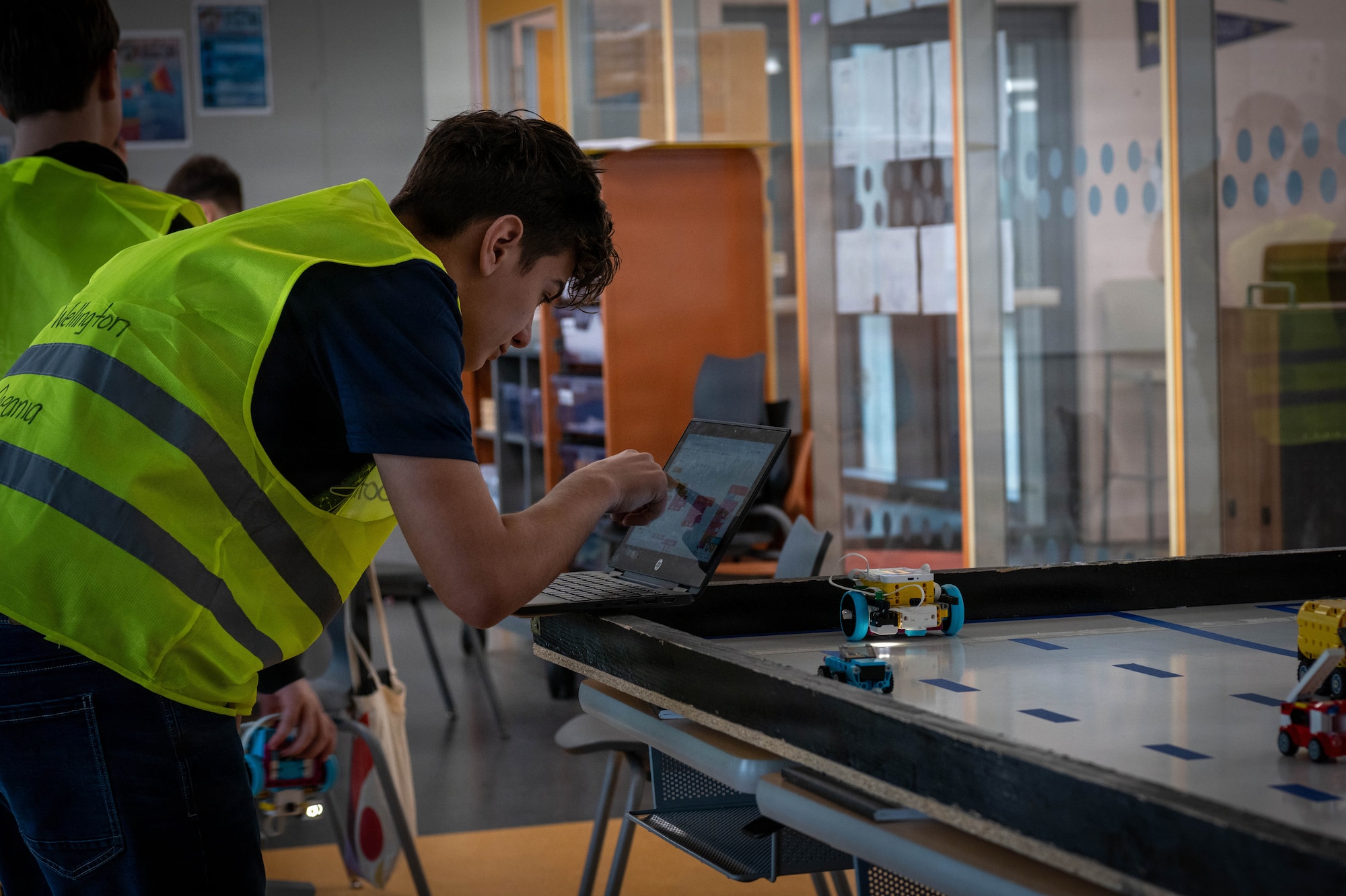 A student looks at a laptop.