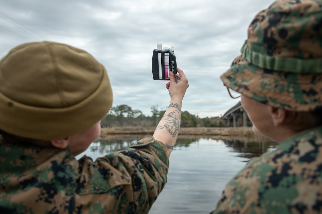260219-M-MS225-1015 U.S. Navy Hospital Corpsman 3rd Class Summer Nelson, left, a preventive medicine technician and Hospital Corpsman 1st Class Jessica Bordonaro, both with Combat Logistics Battalion 8, 24th Marine Expeditionary Unit, test water source for usability during the MEU’s certification exercise at Marine Corps Outlying Landing Field Atlantic, North Carolina, Feb. 21, 2026. CERTEX is a land-based pre-deployment exercise that enhances the integration and collective capability of the Marine Air-Ground Task Force while providing the 24th MEU with an opportunity to train and execute operations in austere and urban environments. (U.S. Marine Corps photo by Lance Cpl. Payton Walley)