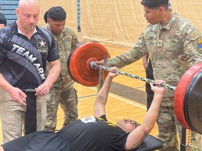 U.S. Army Sgt. Jose Villasenor, assigned to the Soldier Recovery Unit at Fort Bragg, performs the bench press during the powerlifting event at the 2026 Army Trials at Fort Bliss.