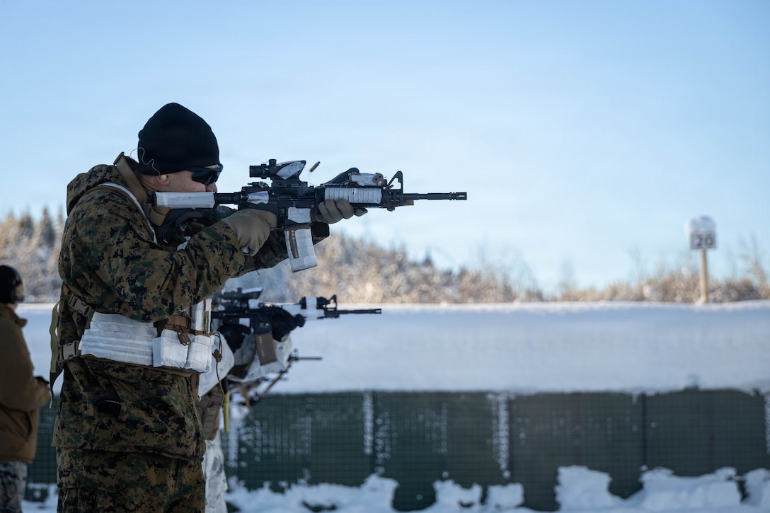 U.S. Navy Hospital Corpsman 2nd Class Darren Plotnick, with 2nd Air Naval Gunfire Liaison Company, II Marine Expeditionary Force Information Group, fires his rifle during the live-fire portion of a biathlon in Bardufoss, Norway, Feb. 23, 2026. The training event, part of exercise Cold Response 26, required participants to ski a 500-meter loop and engage in live-fire exercises to enhance their effectiveness in cold-weather environments. A key component of NATO's enhanced vigilance activity Arctic Sentry, exercise Cold Response 26 is a Norwegian-led winter military exercise designed to enhance collective defense capabilities and ensure U.S. readiness to rapidly deploy and seamlessly operate alongside NATO Allies in challenging arctic conditions. Plotnick is a native of Florida. (U.S. Marine Corps photo by Sgt. Alexis French)