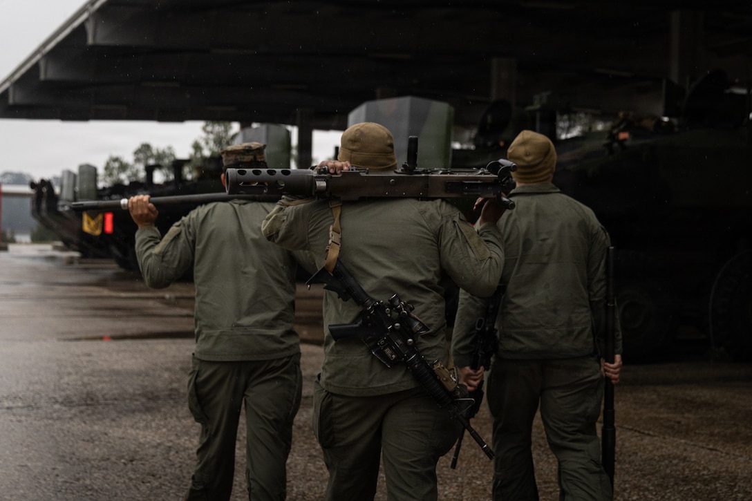 U.S. Marines with Alpha Company, 2nd Assault Amphibian Battalion, 2nd Marine Division, walk toward Amphibious Combat Vehicles prior to a convoy during Type Commander’s Amphibious Training 26.1 at Marine Corps Base Camp Lejeune, N.C., Feb. 27, 2026. TCAT is a military exercise designed to enhance mobility and integration between the U.S. Marine Corps and the U.S. Navy. It allows Marines and Sailors to gain hands-on experience of working side by side in amphibious planning and operations, including the use of multiple surface connectors and air platforms. The training focuses on improving the necessary skills for real-world operations and effective collaboration between Marine Corps and Naval teams. (U.S. Marine Corps photo by Cpl. Osmar VasquezHernandez)