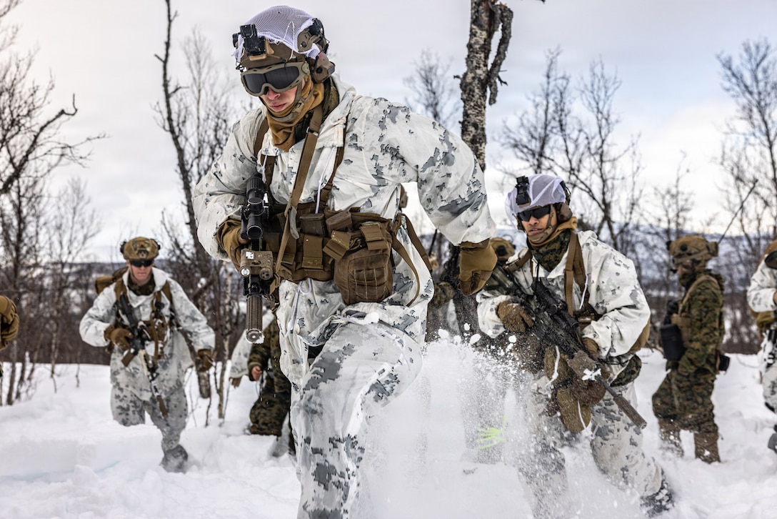 U.S. Marines with 2nd Battalion, 6th Marine Regiment, 2nd Marine Division, tactically move to their next position in Setermoen, Norway, Feb. 28, 2026. The Marines participated in dry-fire and maneuver training to increase combat effectiveness during exercise Cold Response 26. A key component of NATO's enhanced vigilance activity Arctic Sentry, exercise Cold Response 26 is a Norwegian-led winter military exercise designed to enhance collective defense capabilities and ensure U.S. readiness to rapidly deploy and seamlessly operate alongside NATO Allies in challenging arctic conditions. (U.S. Marine Corps photo by Cpl. Judith Ann Lazaro)