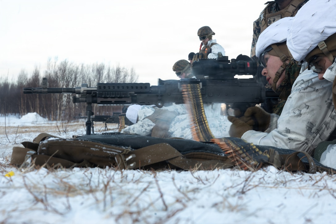 U.S. Marine Corps Sgt. Daniiar Shaidullaev, a logistics specialist with 2nd Distribution Support Battalion, Combat Logistics Regiment 27, 2nd Marine Logistics Group, fires an M240B medium machine gun at a live-fire range in Elvegardsmoen, Norway, Feb. 28, 2026. The training increased weapon proficiency and confidence by requiring Marines and Sailors to apply their knowledge of cold weather gear during live-fire maneuvers in an austere environment. A key component of NATO's enhanced vigilance activity Arctic Sentry, exercise Cold Response 26 is a Norwegian-led winter military exercise designed to enhance collective defense capabilities and ensure U.S. readiness to rapidly deploy and seamlessly operate alongside NATO Allies in challenging arctic conditions. Shaidullaev is a native of Virginia. (U.S. Marine Corps photo by Lance Cpl. Franco Lewis)