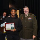 Illinois Army National Guard Commander Brig. Gen. Lenny Williams poses for a photo with Walter H. Dyett High School for the Fine Arts student Aaron Benjamin, the 2026 recipient of the Captain Walter H. Dyett Award on March 2 at the high school.