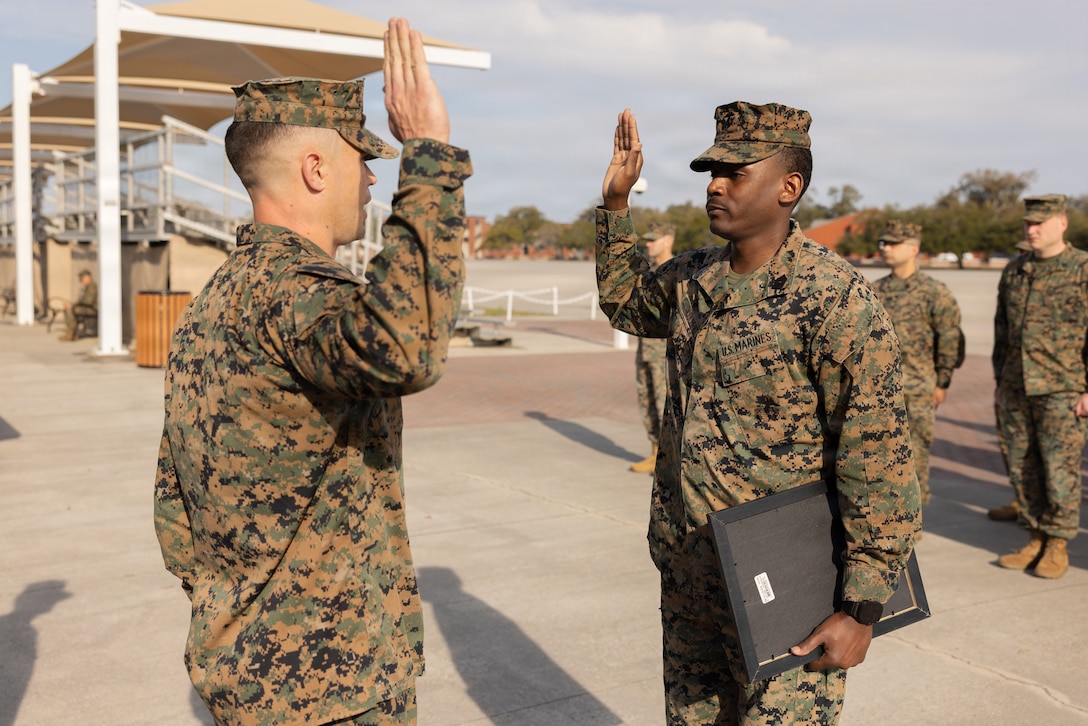 U.S. Marine Corps Master Sgt. Trekevius A. Colbert, a district training team member with 6th Marine Corps District, recites the oath of reenlistment during a promotion ceremony at the Iwo Jima Monument, Marine Corps Recruit Depot Parris Island, South Carolina, March 2, 2026. By taking the oath, Colbert reaffirmed his dedication and the enduring values of the Marine Corps. (U.S. Marine Corps photo by Lance Cpl. Eliel Romero)