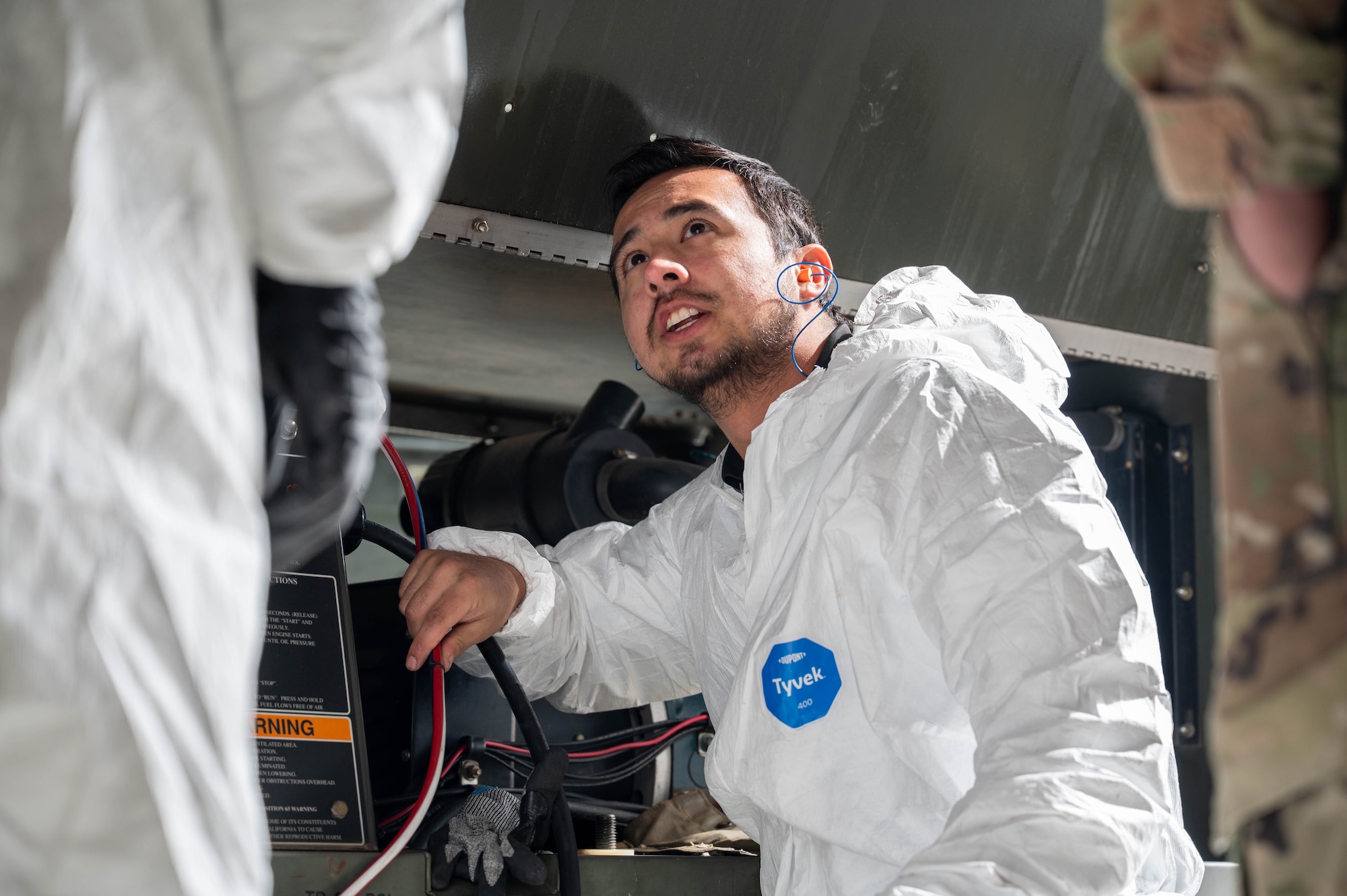 Kaleb Reyna, Engineering and Software System Solutions, Inc. mechanical engineer, connects power to cold spray equipment at Dyess Air Force Base, Texas, Feb. 20, 2026. The cold spray system applies a metal coating to restore damaged aircraft and ground support equipment components   without melting or weakening the original material. (U.S. Air Force photo by Airman 1st Class William Neal)