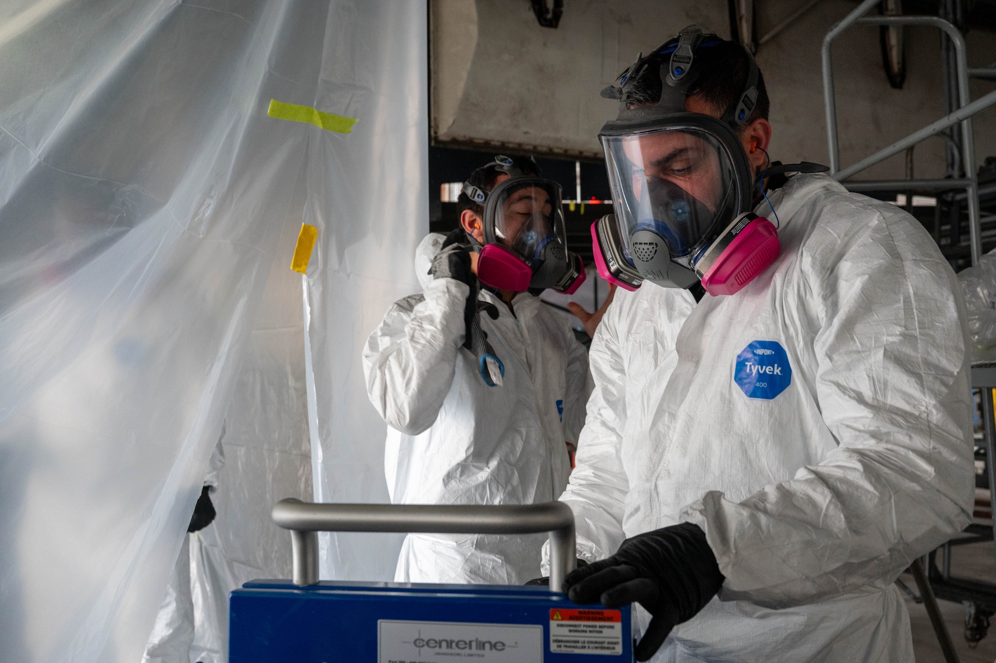 Marc Gilbert, Engineering and Software System Solutions, Inc. mechanical technician, powers up cold spray equipment at Dyess Air Force Base, Texas, Feb. 20, 2026. The cold spray process restores metal surfaces by bonding accelerator powder particles to the damaged area. (U.S. Air Force photo by Airman 1st Class William Neal)
