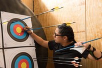 Veteran Hope Gonzales marks her target during an archery competition March 3, 2026, at the Ronald D. Milam Physical Fitness Center at Fort Bliss, Texas.