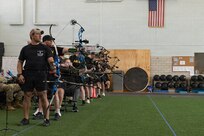 The second group of competitors takes practice shots during an archery competition March 3, 2026, at the Ronald D. Milam Physical Fitness Center at Fort Bliss, Texas.