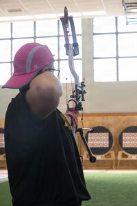 U.S. Army Master Sgt. Jodi Pyle-VanderSys, a chemical, biological, radiological, and nuclear specialist assigned to the Soldier Recovery Unit at Fort Carson, looses an arrow during an archery competition March 3, 2026.