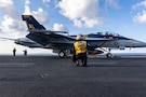 A U.S. Sailor signals to launch a F/A-18F Super Hornet, attached to Strike Fighter Squadron 213, on the flight deck of the world’s largest aircraft carrier, USS Gerald R. Ford (CVN 78), while operating in support of Operation Epic Fury in the Eastern Mediterranean Sea, March 2, 2026. (U.S. Navy photo)
