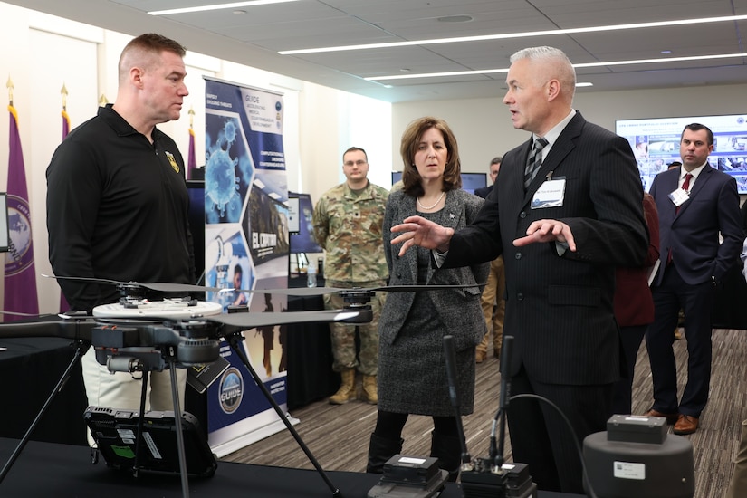 Army Maj. Gen. Christopher Beck (left), PAE LP & CBRND and Ms. Nicole Kilgore, CPE CBRND learn about CBRN Sensor Integrated on Robotics Platform (CSIRP), a part of the “avoid being hit” portion of formation based layered protection, during a visit to CPE CBRND.