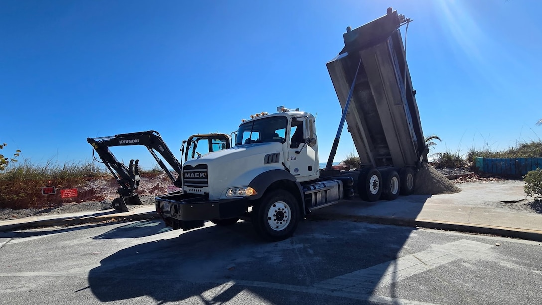A U.S. Army Corps of Engineers (USACE) Jacksonville District dump truck delivers the first load of sand at Jetty Park, Fort Pierce, Fla, on Saturday, Feb. 14, 2026, as crews rush to shore up an eroding shoreline that threatens a public road, nearby homes and underground utilities, after a request for immediate assistance came into the district from Congressman Brian Mast’s office. Eleven loads totaling approximately 220 tons of sand were delivered by USACE trucks and operators throughout the operation. (U.S. Army Corps of Engineers photo by Blake Stratton)