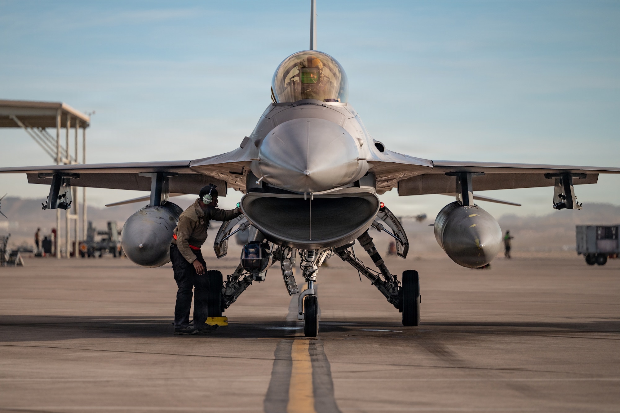 a person inspects a jet