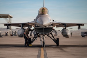a person inspects a jet