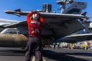 A U.S. Sailor checks ordinance on an F/A-18E Super Hornet, attached to Strike Fighter Squadron (VFA) 151, on the flight deck of Nimitz-class aircraft carrier USS Abraham Lincoln (CVN 72) in support of Operation Epic Fury, Mar. 3, 2026.  (U.S. Navy photo)