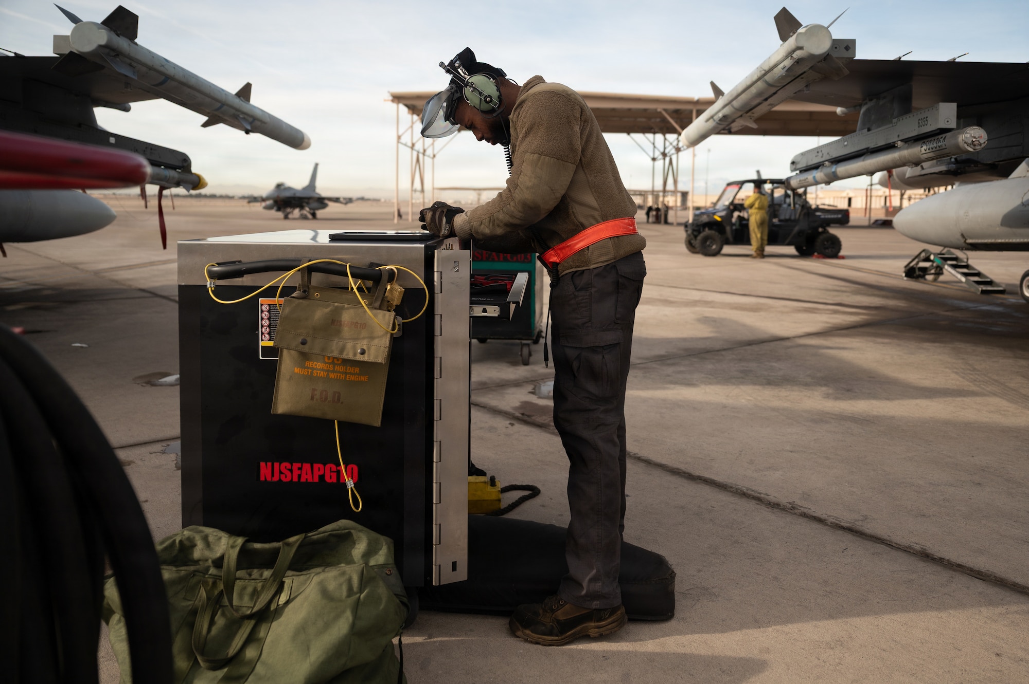 a person stands next to a tool box