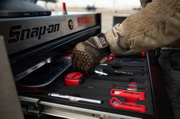 a person picks up tools