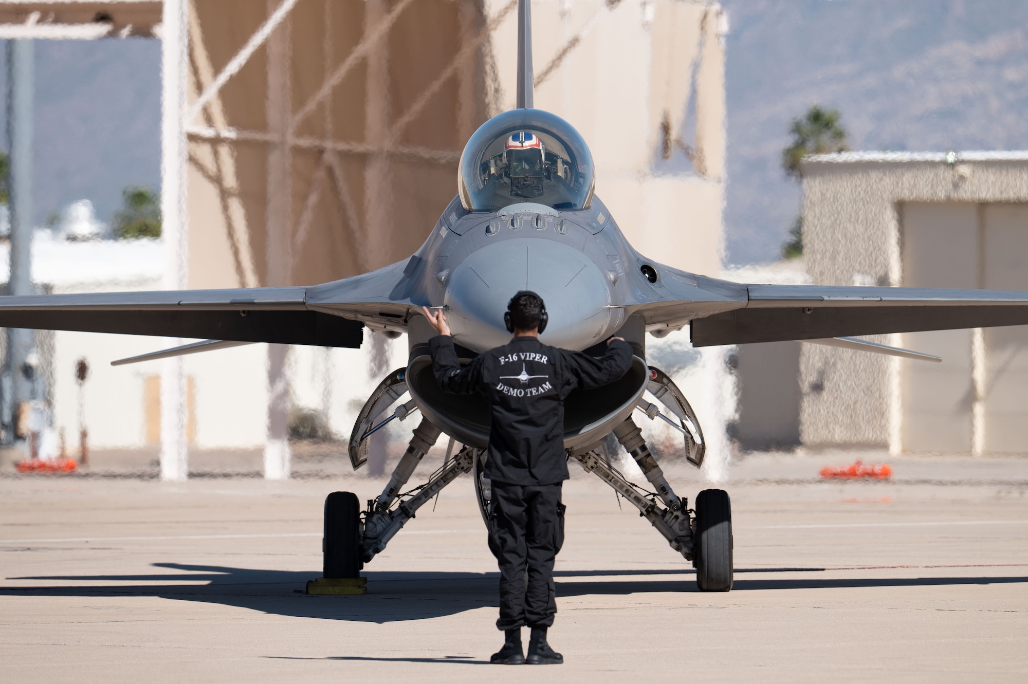 U.S. Air Force Maj. Taylor “FEMA” Heister, F-16 Demonstration Team pilot and commander, completes the final safety checks before performing in the Heritage Flight Training Course at Davis-Monthan Air Force Base, Arizona, Feb. 28, 2026. The Viper demonstration team consists of eight maintainers, a public affairs specialist and a pilot, who travel across the United States and overseas to exhibit the combat capabilities of the F-16 Fighting Falcon and to inspire and recruit a new generation of Airmen. (U.S. Air Force Photo by Airman 1st Class Jaden Kidd)
