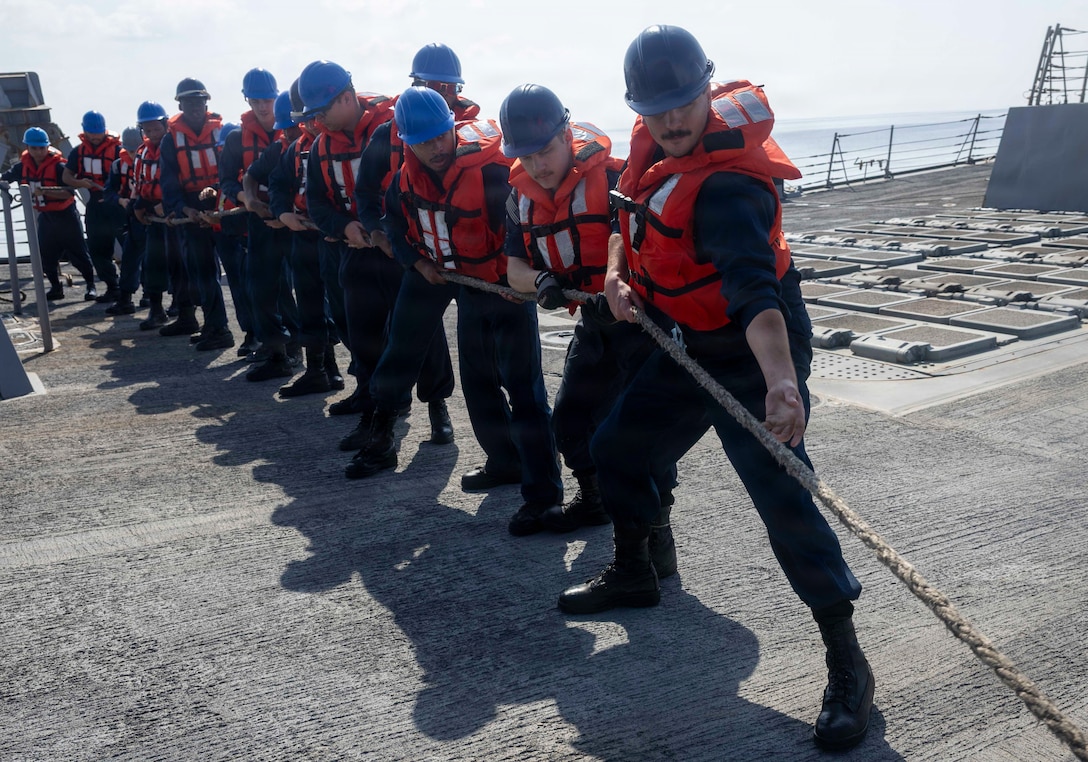 U.S. Sailors, assigned to Arleigh Burke-class guided-missile destroyer USS Delbert D. Black (DDG 119), heave a line during a replenishment-at-sea with fleet replenishment oiler USNS Henry J. Kaiser (T- AO 187), in the U.S. Central Command area of responsibility in support of Operation Epic Fury, Mar. 3, 2026. (U.S. Navy photo)