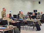 Army National Guard safety professionals participate in a classroom discussion during the Army National Guard Safety Orientation and Mentorship Course at Martindale Army Airfield Armory in San Antonio. The course brings safety leaders from across the nation together to share lessons learned, discuss risk management practices and strengthen safety programs that support Soldier readiness. Photo by Maj. Craig Heilig.