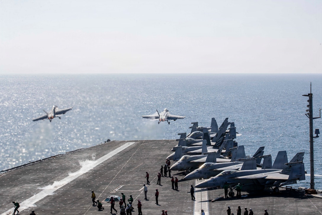 Two F/A-18 Super Hornets launch from the flight deck of Nimitz-class aircraft carrier USS Abraham Lincoln (CVN 72) in support of Operation Epic Fury, March 3, 2026. (U.S. Navy photo)