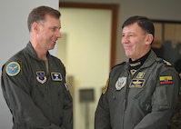 U.S. Air Force Maj. Gen. David Mineau, left, Air Forces Southern commander, interacts with Fuerza Aérea Ecuatoriana (FAE) Maj. Gen. Luis Fierro Urresta, Ecuadorian air force chief of staff, during the U.S. and Ecuadorian Airman-to-Airman staff talks, at Davis-Monthan Air Force Base, Arizona, March 3, 2026. AFSOUTH personnel met with Ecuadorian Air Force officials for an annual headquarters staff talks to review shared security cooperation goals and strengthen U.S.–FAE partnership and interoperability. (U.S. Air Force photo by Staff Sgt. Abbey Rieves)