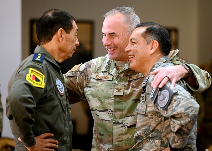 U.S. Air Force Col. Barton Kenerson, center, Air Forces Southern director of logistics, installations and mission support, interacts with Fuerza Aérea Ecuatoriana (FAE) personnel during the U.S. and Ecuadorian Airman-to-Airman staff talks, at Davis-Monthan Air Force Base, Arizona, March 3, 2026. The engagement was designed to deepen professional military relationships, improving joint operational capabilities between the U.S. and FAE. (U.S. Air Force photo by Staff Sgt. Abbey Rieves)