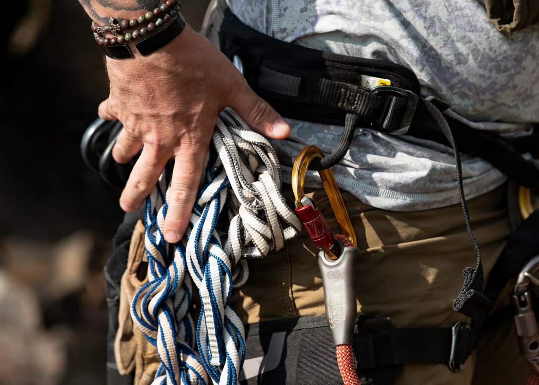 U.S. Army Staff Sgt. Brandon Valverde, Defense POW/MIA Accounting Agency mountaineer, performs a gear check during a recovery mission in Laos, Jan. 21, 2026.